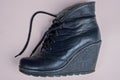 One black leather boot with soles Royalty Free Stock Photo