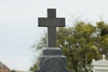 One black marble cross on the monument at the grave in the cemetery