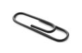 One black paper clip isolated on white Royalty Free Stock Photo
