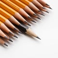 One black pencil leading group of classic yellow pencils