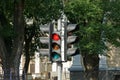 One black retro traffic light on a gray pillar on the street Royalty Free Stock Photo