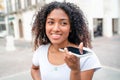 One black woman cellphone voice message in the city Royalty Free Stock Photo