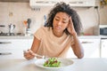 One black woman feeling hungry eating poor calories food for diet