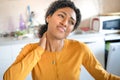 One black woman working at home suffering neck pain