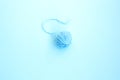 One blue ball of woolen thread on a light background Royalty Free Stock Photo