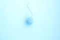 One blue ball of woolen thread on a light background Royalty Free Stock Photo