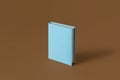 One blue book on a brown background with soft shadow, copy space. Book Lovers Day concept Royalty Free Stock Photo