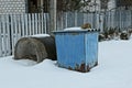 One blue iron trash can and a concrete ring Royalty Free Stock Photo