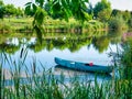 One blue sit on top kayak or boat on Comana lake in Comana Natural Park, Romania