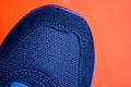 one blue sneaker on a red background Royalty Free Stock Photo