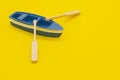 One blue toy boat. small boat models with oars