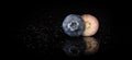 One Blueberry cut in half on a reflective surface, water droplets, black background close up