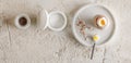 One boiled egg in stoneware egg cup with egg shell broken pieces in concrete tray, salt flakes and pepper Royalty Free Stock Photo