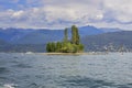 A small green island in the blue lake.