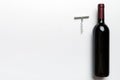 One Bottle of red wine with corkscrew on colored table. Flat lay, top view wth copy space Royalty Free Stock Photo