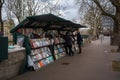 One of the Bouquinistes, selling antique books along the river Seine in Paris, France