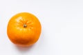 One bright ripe orange glossy tangerine in orange peel on white background Royalty Free Stock Photo