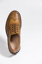 One Brogue Derby Shoe of Calf Leather with Rubber Sole Over Pure White Background Royalty Free Stock Photo