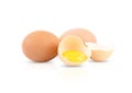 One broken egg and two whole eggs isolated on a white background Royalty Free Stock Photo