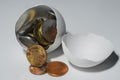 One broken chicken egg and the american cents