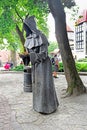 One of the bronze `Three Monks` at the Danish King Garden in Old Town of Tallinn, Estonia