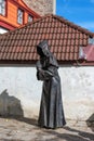 One of the bronze Three Monks at the Danish King`s Garden in Old Town of Tallinn, Estonia.