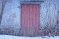 one brown closed wooden door on a gray brick wall of a private old house Royalty Free Stock Photo