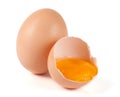 One brown egg and broken egg isolated on white background Royalty Free Stock Photo