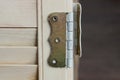 One brown iron door hinge on a gray plank Royalty Free Stock Photo