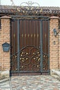 One brown metal door with black iron wrought  pattern Royalty Free Stock Photo