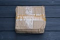 one brown paper closed square parcel cardboard box