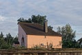 One brown private house under a tiled roof and a metal chimney on the street Royalty Free Stock Photo