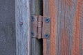 One brown small rusty iron door hinge Royalty Free Stock Photo