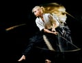 Iaido Kenjutsu budoka woman isolated black background