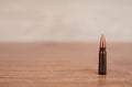 One bullet on a wooden background Royalty Free Stock Photo
