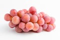One bunch of ripe organic pink grapes isolated on white background, top view or flat lay photograph of healthy fruits and vegan fo Royalty Free Stock Photo