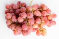 One bunch of ripe organic red pink grapes isolated on white background, top view with soft focus of tasty healthy food Royalty Free Stock Photo