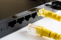 One cable is inserted into the router the second lies next to the router Royalty Free Stock Photo