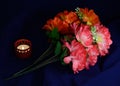 One candle artificial flowers Royalty Free Stock Photo
