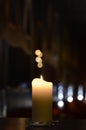 One candle at night with light reflections Royalty Free Stock Photo