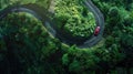 one car running on curve asphalt road through green mountain.