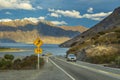 One car runs up the hill in the evening at Lake Hawea, Wanaka Otago, New Zealand, mountains and lakes with blue sky Royalty Free Stock Photo