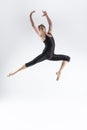 One Caucasian Ballet Dancer Young Athletic Man in Black Suit Posing Dancing in Studio On White Royalty Free Stock Photo