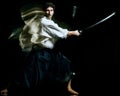 Iaido Kenjutsu budoka man isolated black background