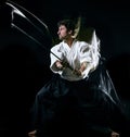 Iaido Kenjutsu budoka man isolated black background Royalty Free Stock Photo