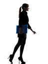 Business woman holding folders files walking silhouette Royalty Free Stock Photo