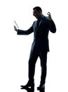 Business man angry digital tablet isolated Royalty Free Stock Photo