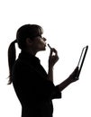 Business woman applying lipstick computer computing digital tab Royalty Free Stock Photo