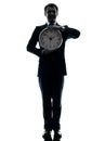 Business man holding clock silhouette Royalty Free Stock Photo