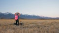 One caucasian children walk with bike in wheat field. Little girl walking black orange cycle on background of beautiful Royalty Free Stock Photo